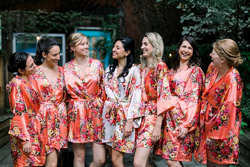 bride with bridesmaids in floral robes
