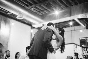 bride and groom kiss on dance floor